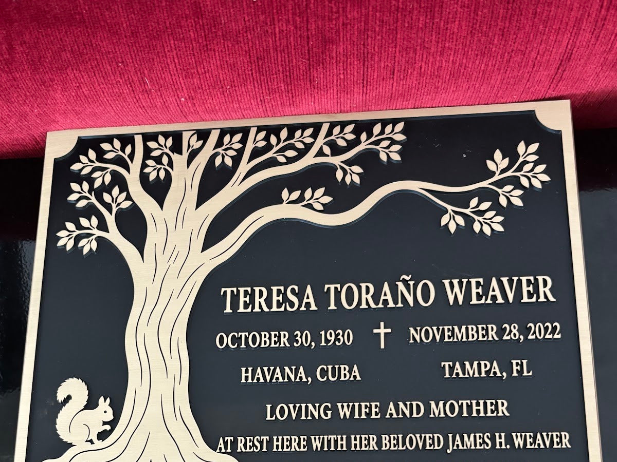 Finished bronze memorial plaque shared by Jaws Tree Service in Tampa, Florida