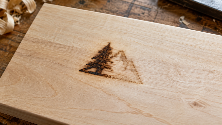 Illustrative photo of a heat-branded maker's mark dark on the left and faint on the right