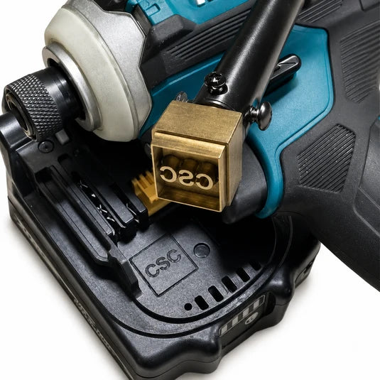 Cordless drill mounted on a battery pack with a brass quick-release clamp