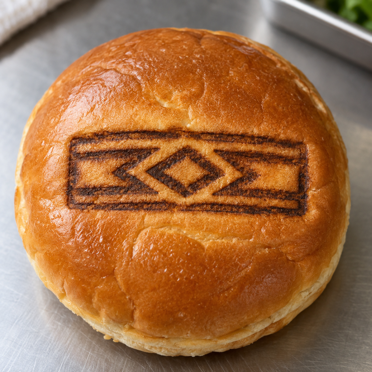 Illustrative rectangular custom brand on a hamburger bun
