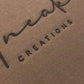 Actual archival electric-branding result on our cardboard packaging under the Uneak Creations name